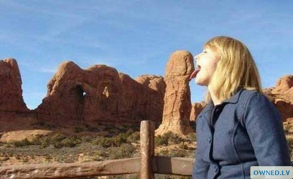 girl posing as if she is lickin penis.
