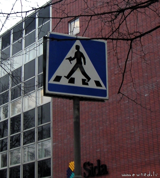 Road crossing with uzi sign